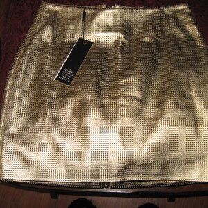 Adorable Gold Lame leather mini skirt zips all the way down in the back!